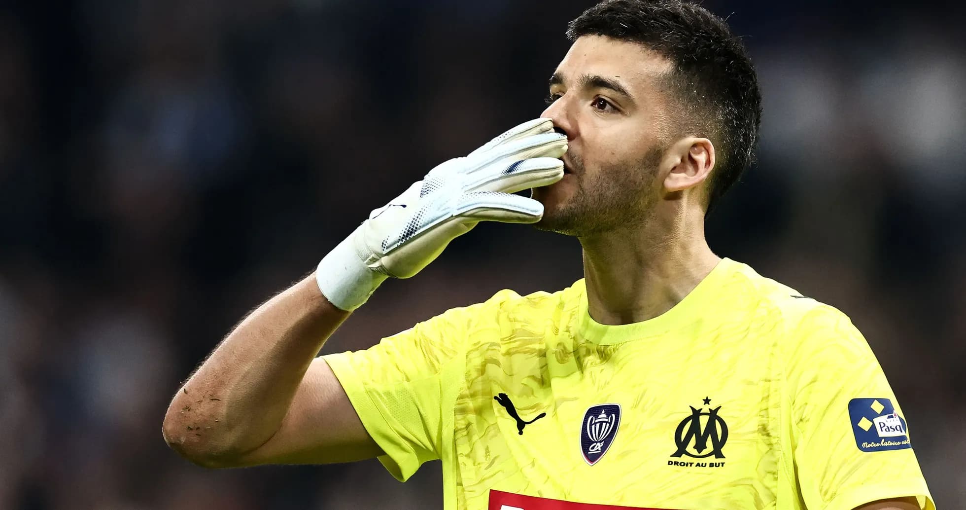 Goalkeeper celebrating with gloves after a match