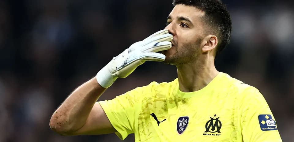 Goalkeeper celebrating with gloves after a match