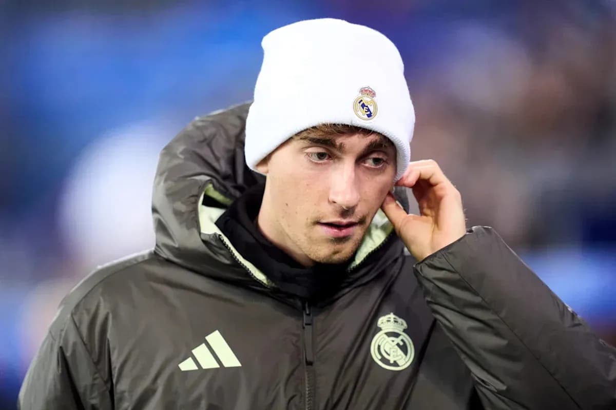 Player wearing Real Madrid jacket and beanie