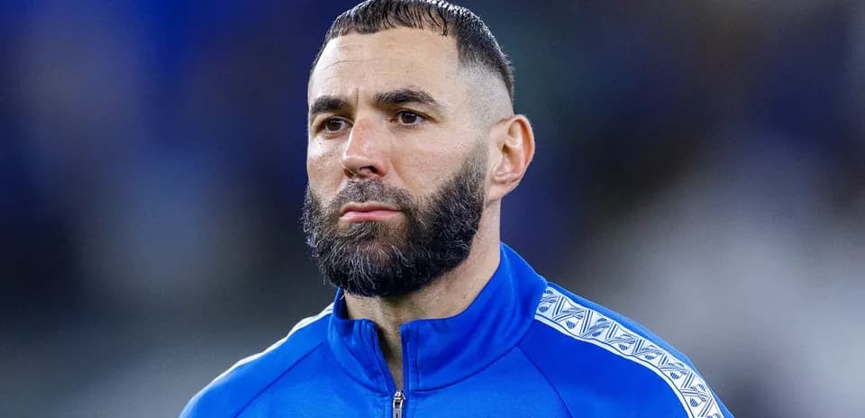 Player in blue training kit with beard
