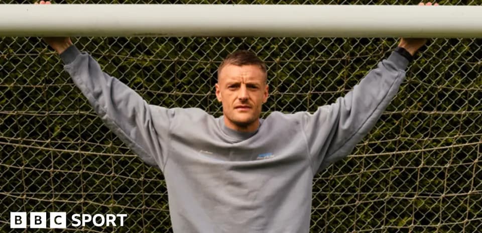 Player posing in front of goalpost at training