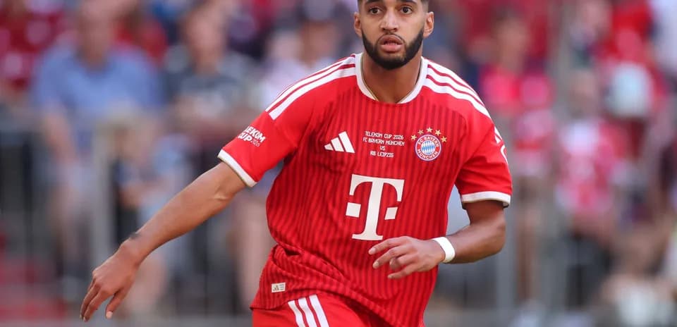 Player running in Bayern Munich red jersey during match