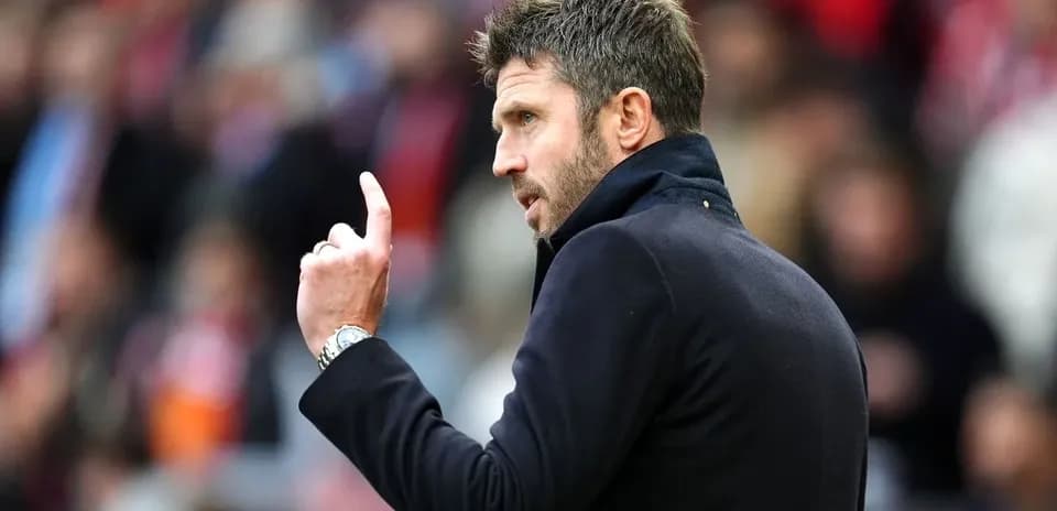 Coach gesturing during a match on the sideline