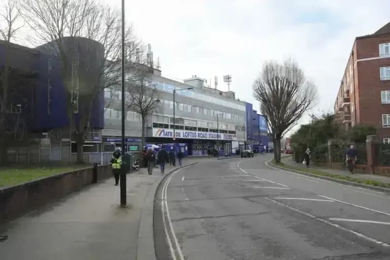 Exterior view of Loftus Road Stadium on a street