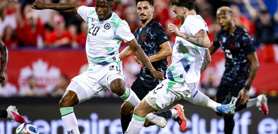 Players competing for the ball during soccer match