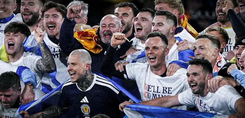 Celebrating players in team shirts with flags