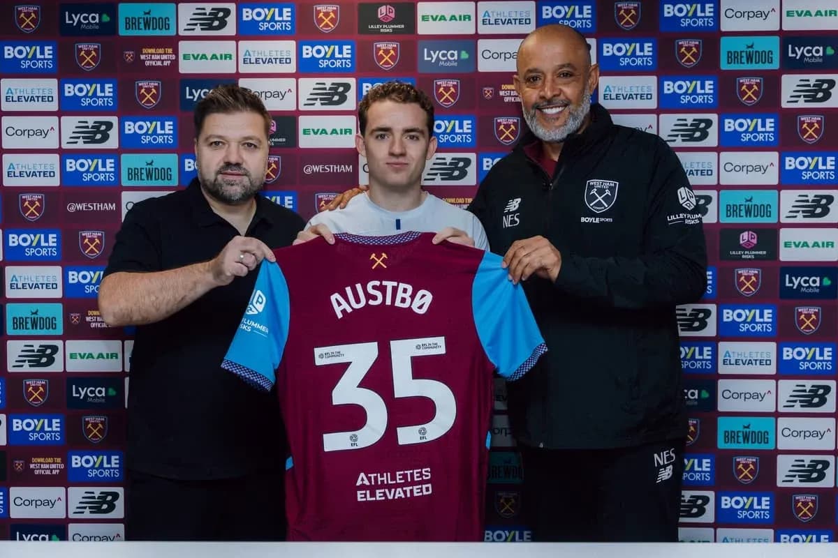 Player holding jersey at West Ham United announcement