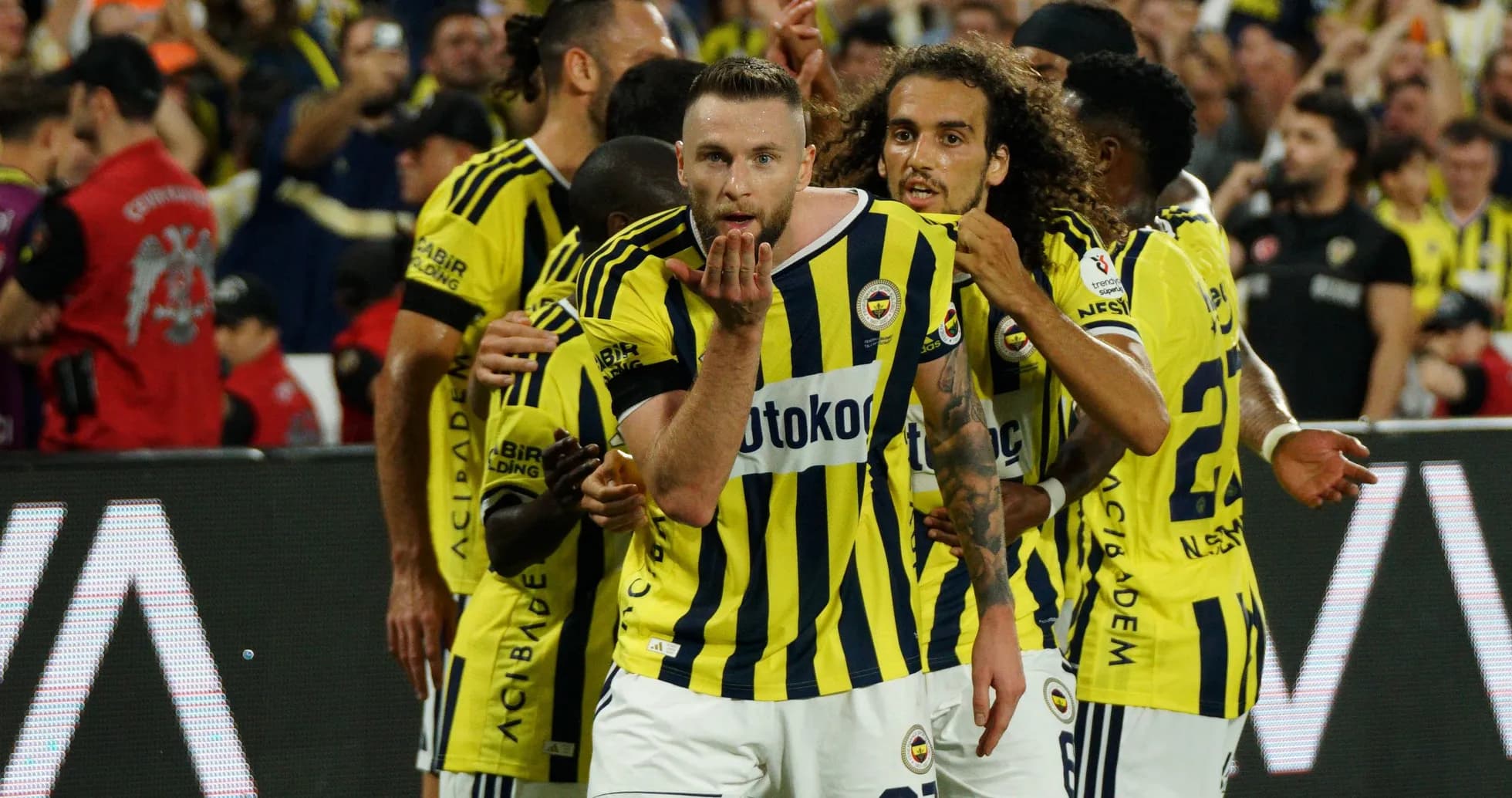 Fenerbahçe players celebrating a goal together