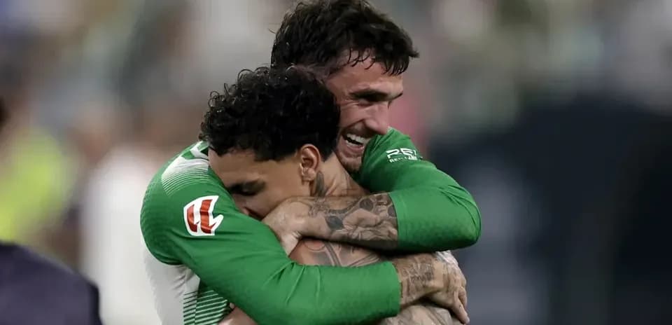 Two players embracing after a victory celebration