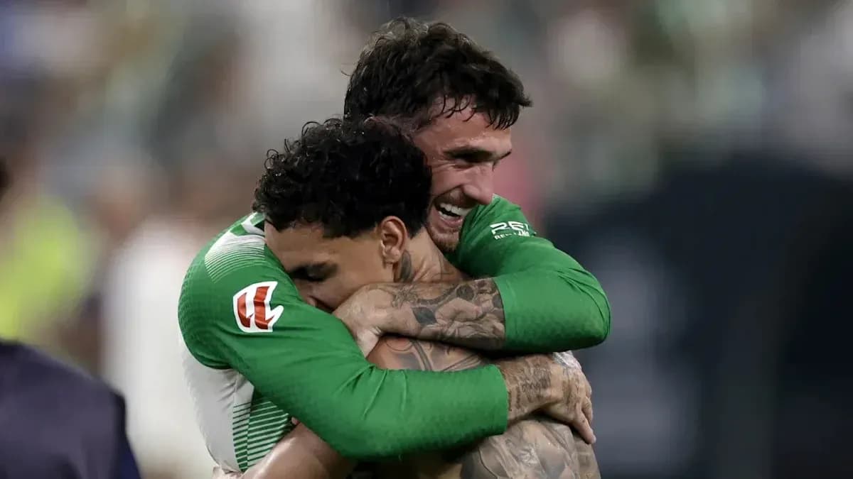 Two players embracing after a victory celebration