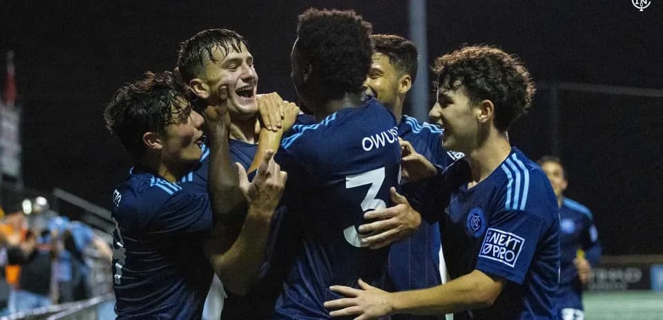 Players celebrating a goal during MLS Next Pro match