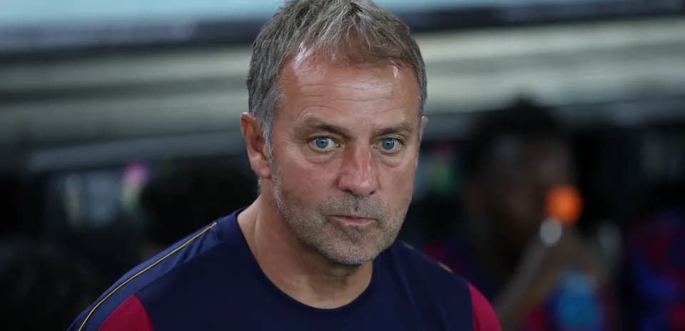 Coach focused during match on the sidelines
