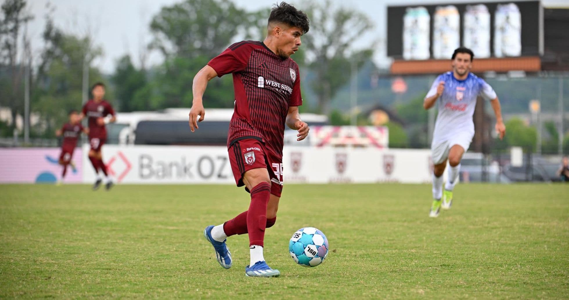 One Knoxville player dribbling the ball