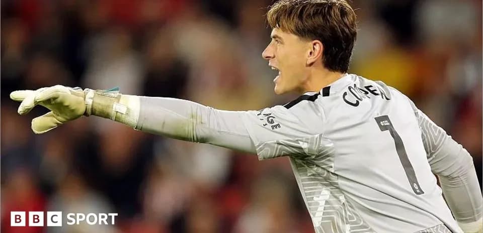 Goalkeeper shouting and directing teammates during match