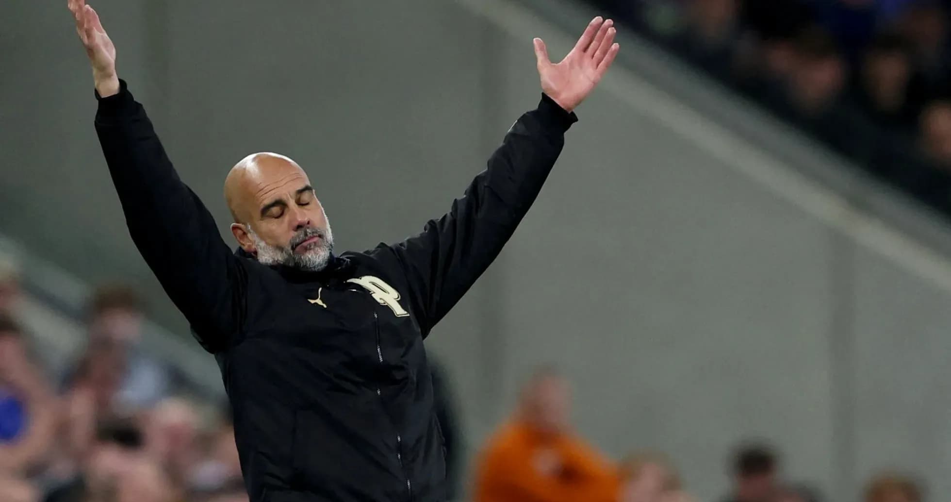 Manager gesturing during a football match