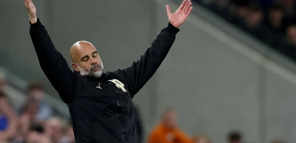 Manager gesturing during a football match