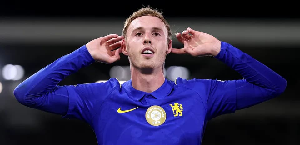 Player celebrating with hands on ears after scoring