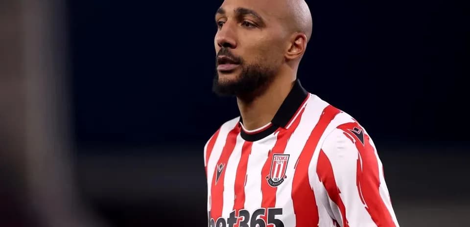 Player wearing Stoke City jersey during match