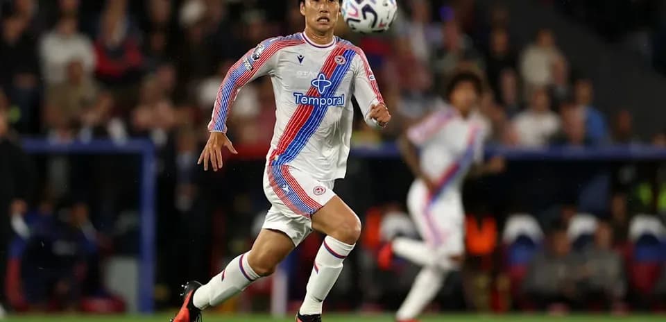 Player sprinting after the ball during match