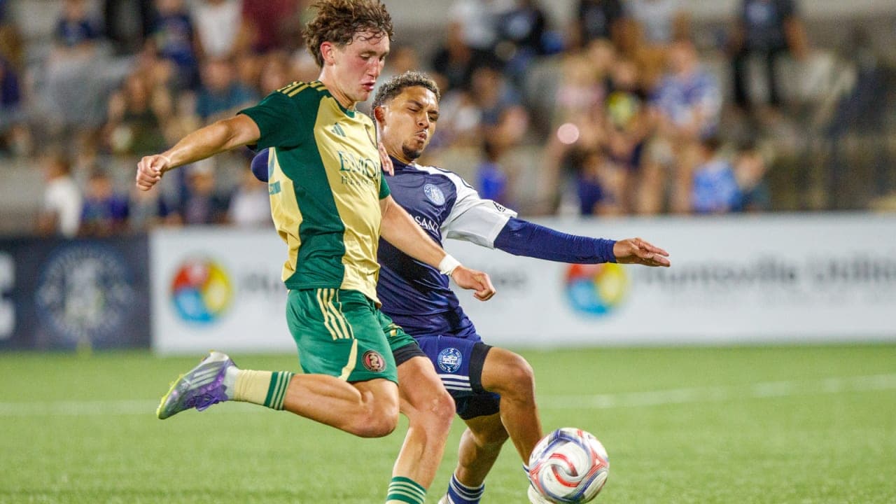 Player kicking ball during Huntsville City match