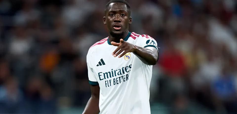Player gesturing during match in Real Madrid kit