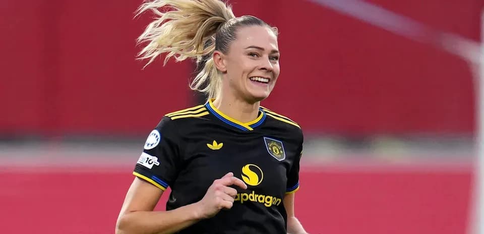 Female player celebrating during a football match