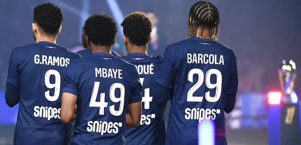 Players from team wearing blue jerseys with numbers