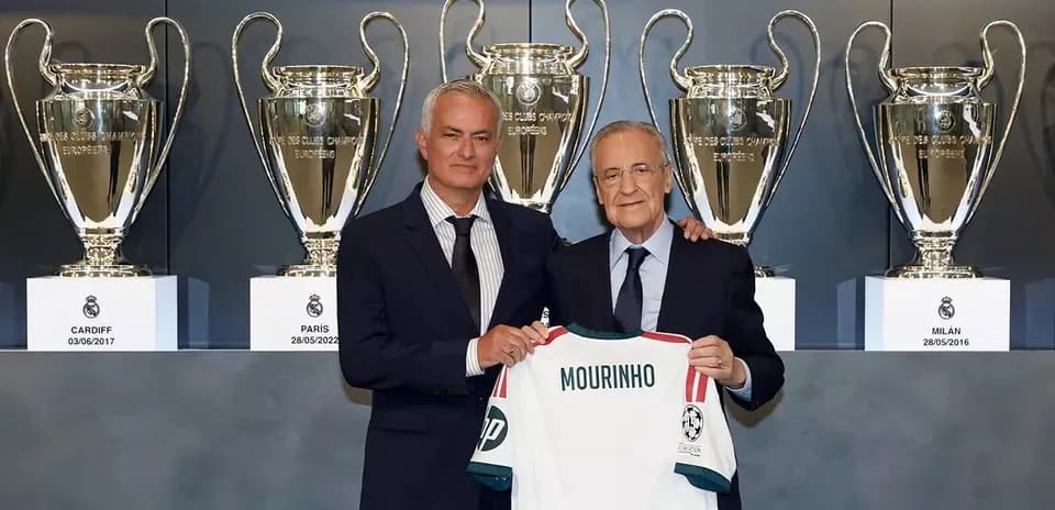 Jose Mourinho holding jersey with club president and trophies