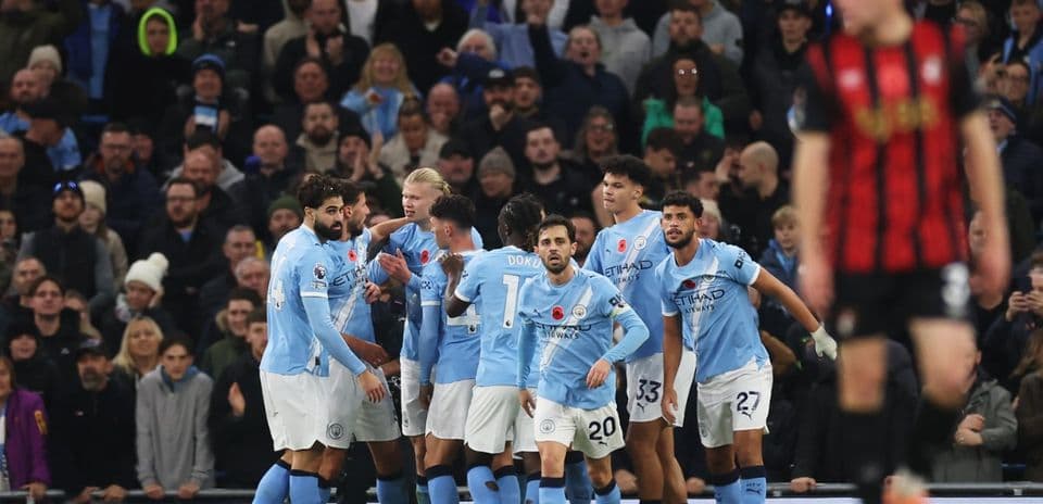Manchester City players celebrating a goal