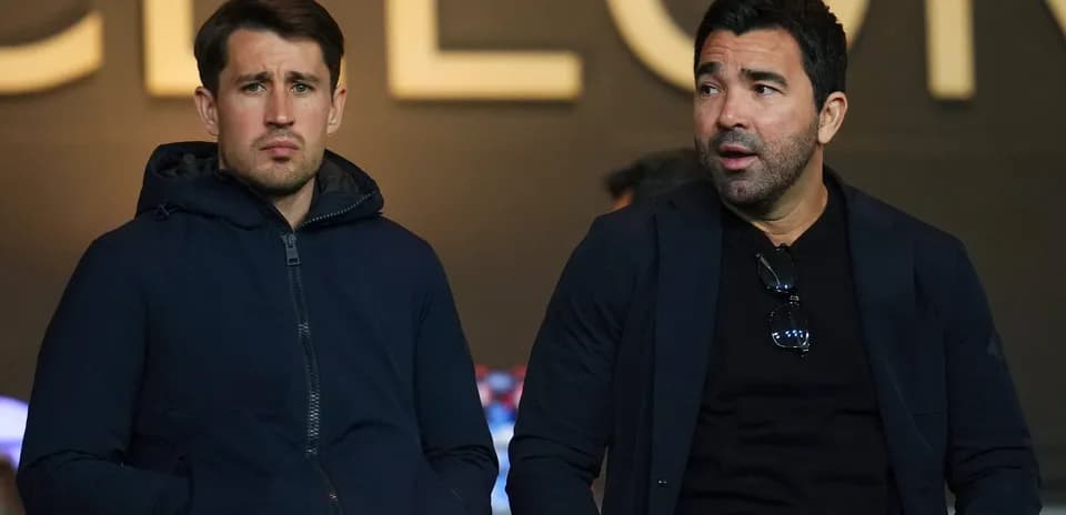 Two men sitting together in a stadium