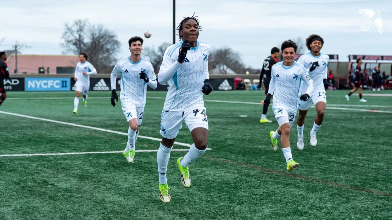 Players celebrating a goal during match