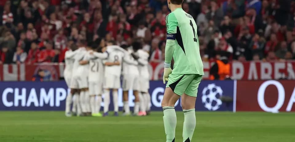 Goalkeeper watching teammates celebrate a goal