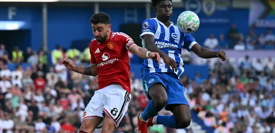 Bruno Fernandes and defender contesting a high ball