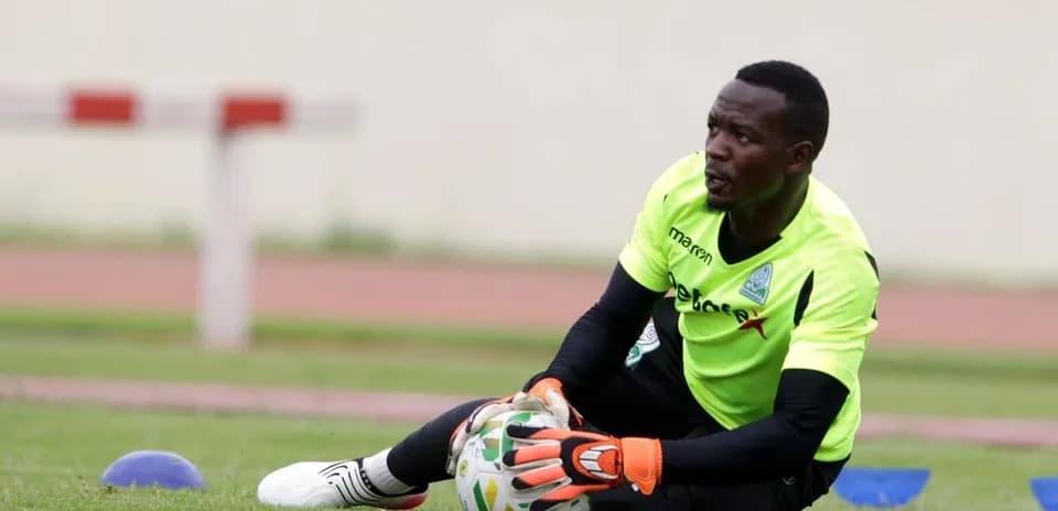 Goalkeeper practicing with ball during training session