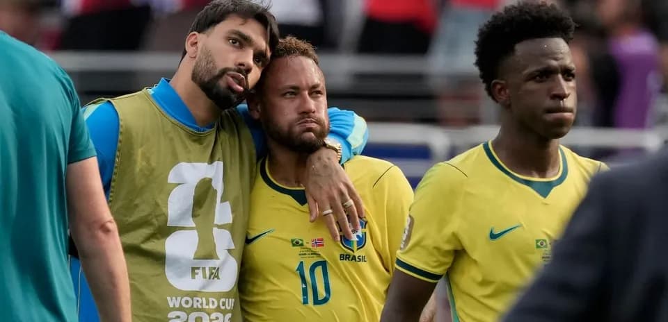 Brazilian players walking off the pitch after match