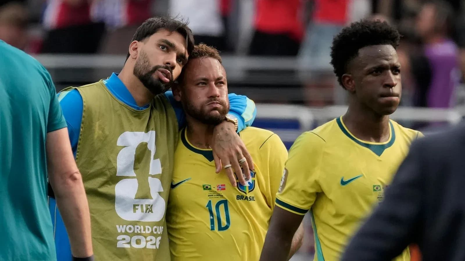 Brazilian players walking off the pitch after match