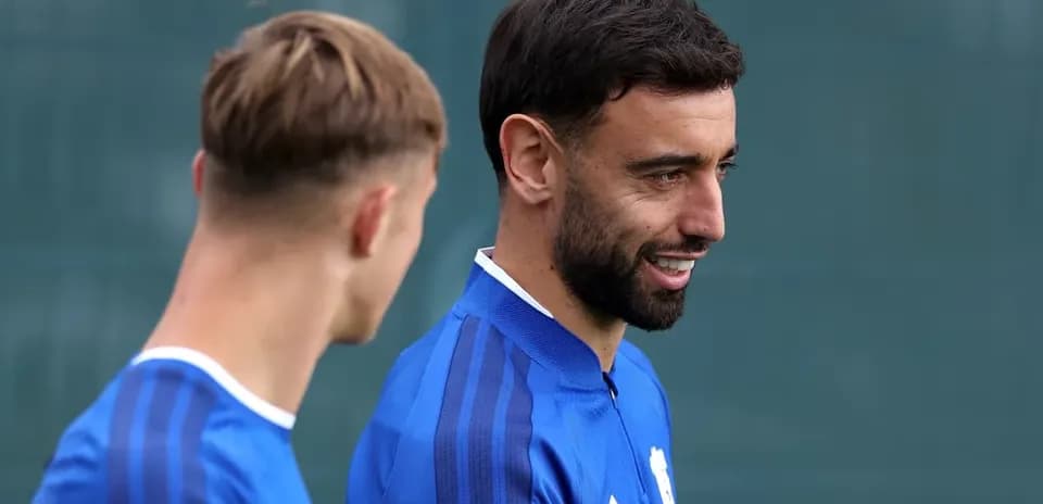 Two players chatting during training session