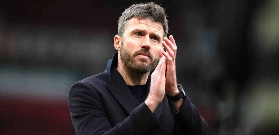 Coach clapping hands in stadium after match