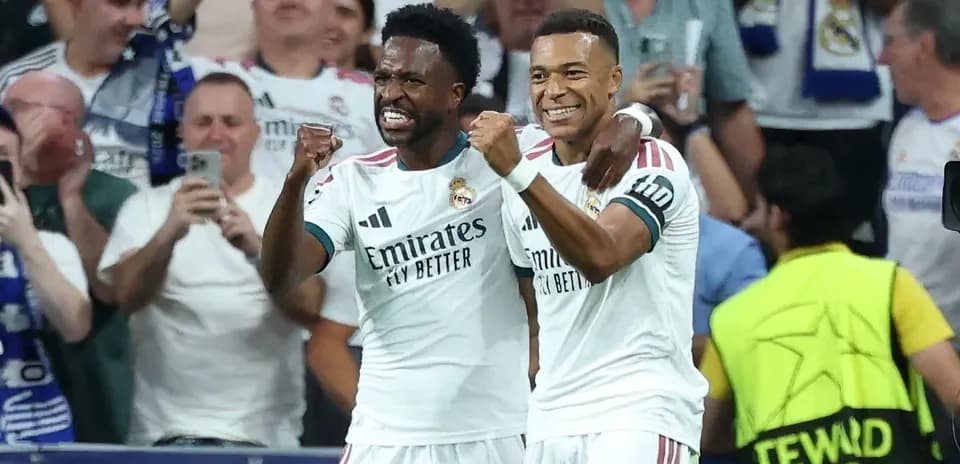 Real Madrid players celebrating a goal together