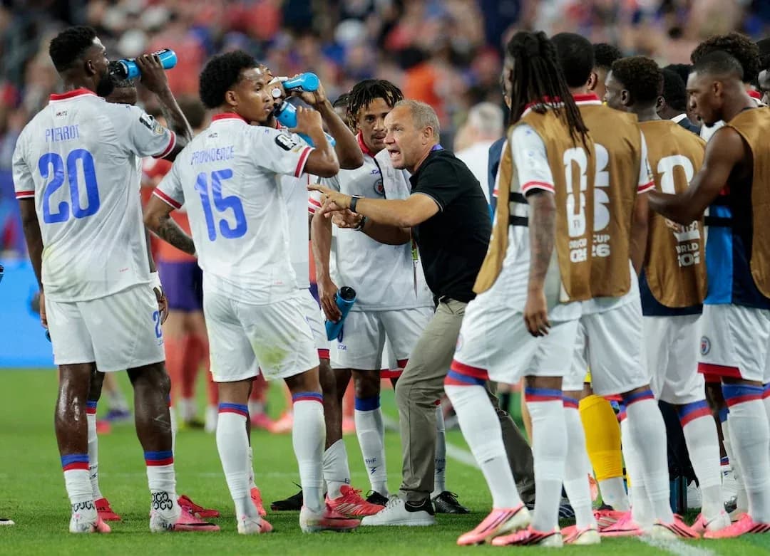 Haitian players receiving instructions during a match