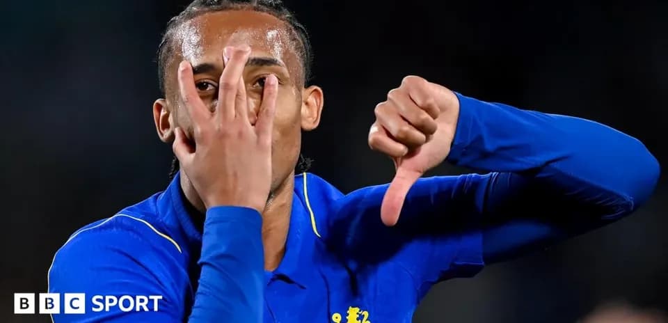 Player celebrating with hand gestures after scoring