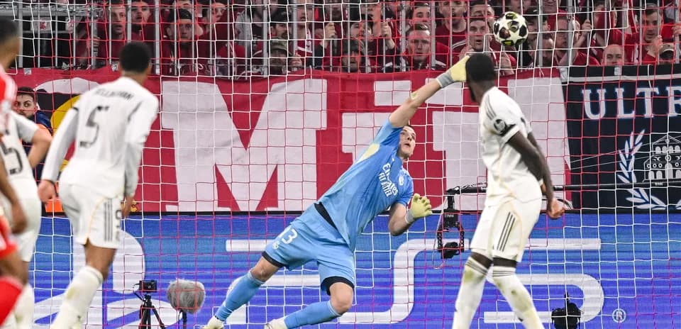 Goalkeeper making a save during Bayern vs Real match