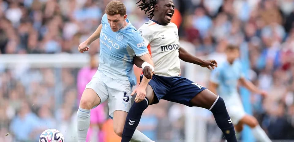 Manchester City player tackles Coventry opponent