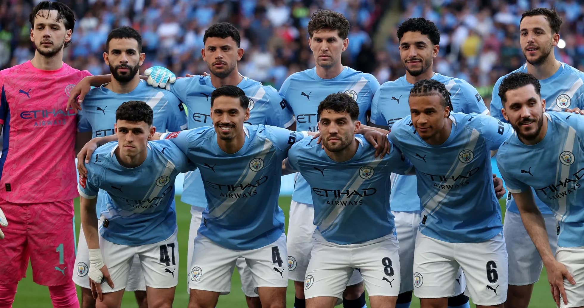 Manchester City players posing for team photo