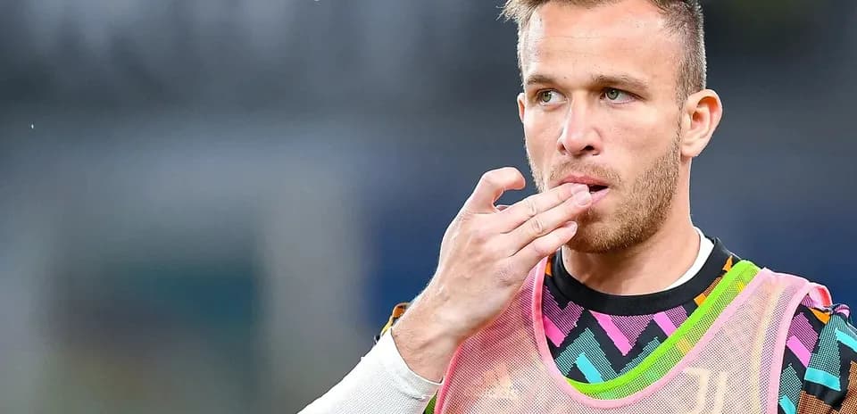 Player in warm-up jersey touching his mouth