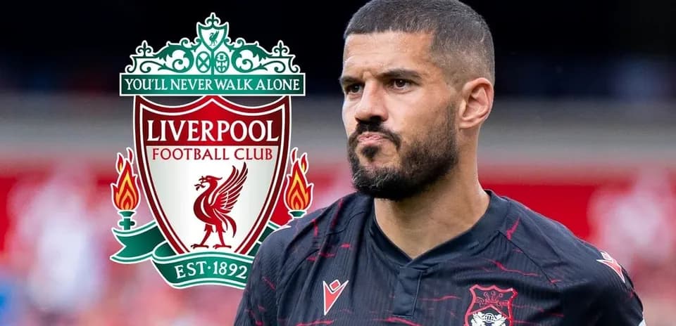 Player in Liverpool kit with club logo background