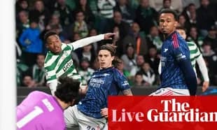 Celtic player attempting to score against defenders