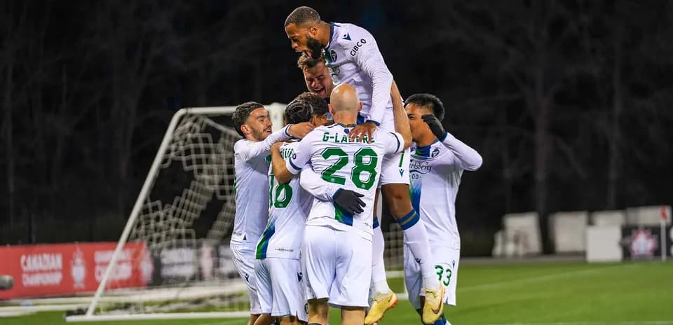 Players celebrating a goal in Canadian Premier League