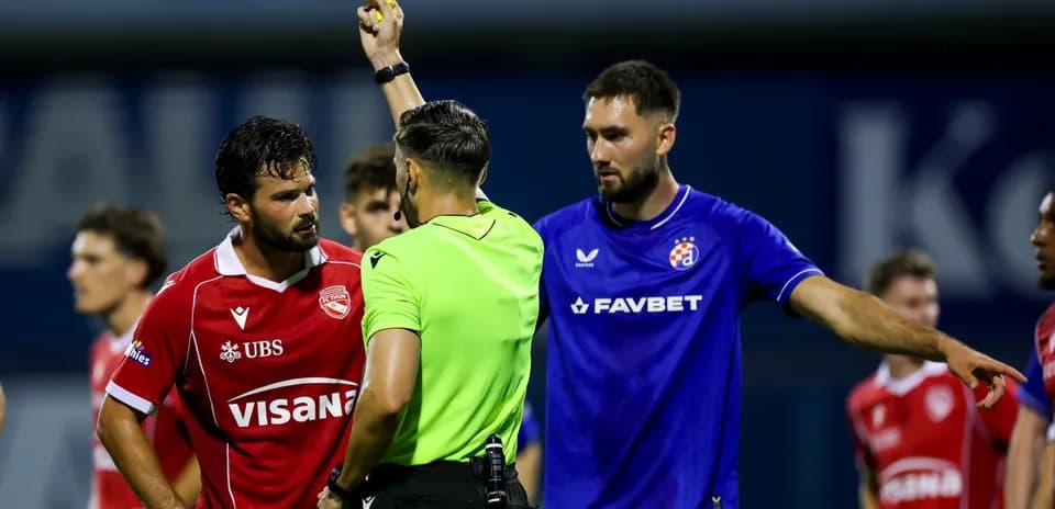 Referee showing red card during match