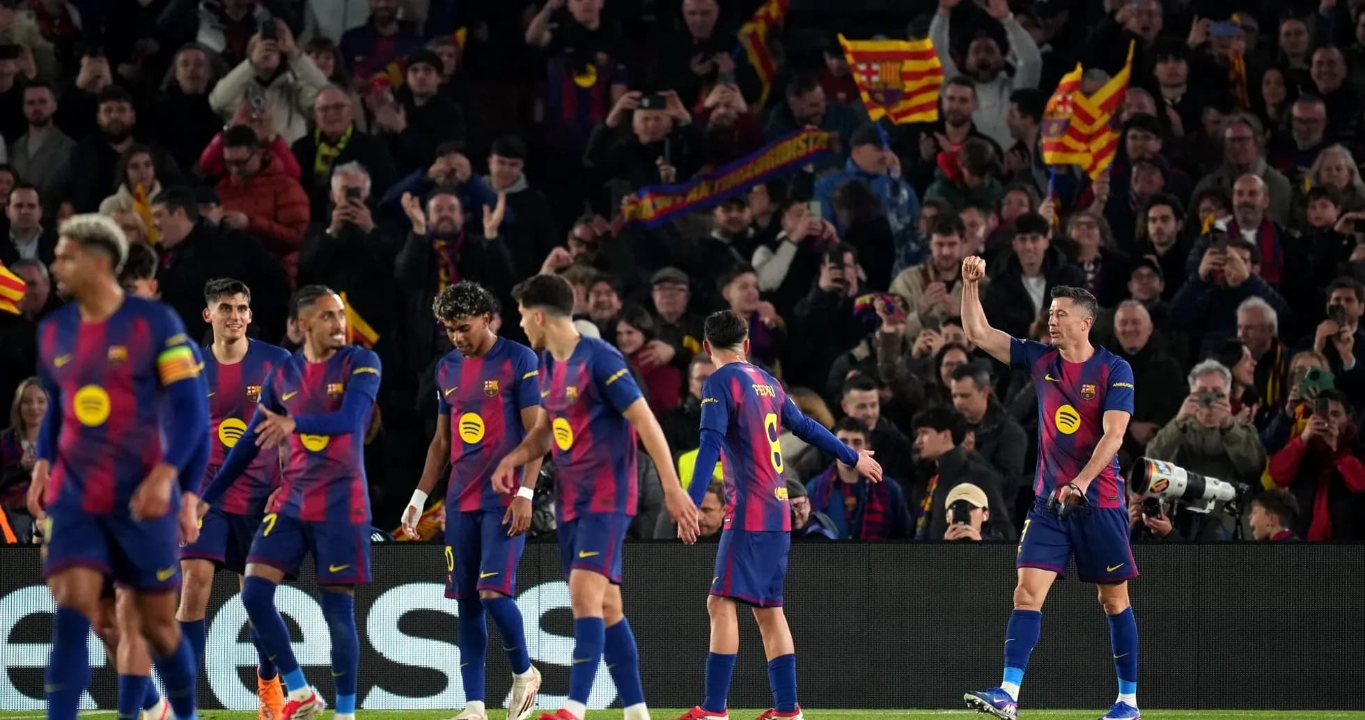 Barcelona players celebrating in UEFA Champions League match